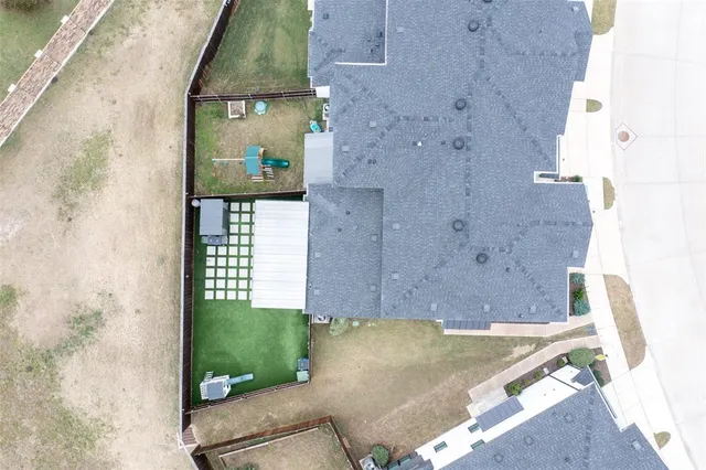 an aerial view of residential houses with outdoor space