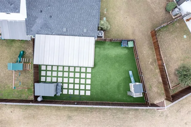 an aerial view of residential house with outdoor space