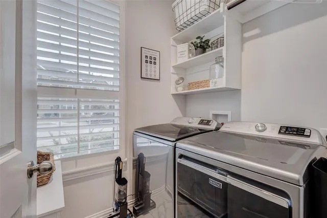 a utility room with washer and dryer