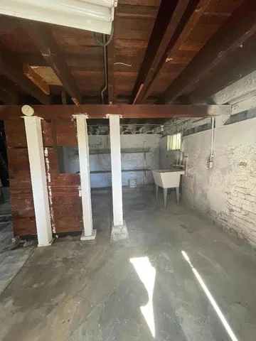 a view of a room with wooden shelves