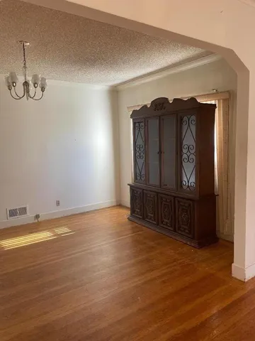 a view of a livingroom with wooden floor