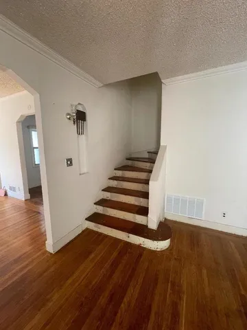 a view of entryway with wooden floor