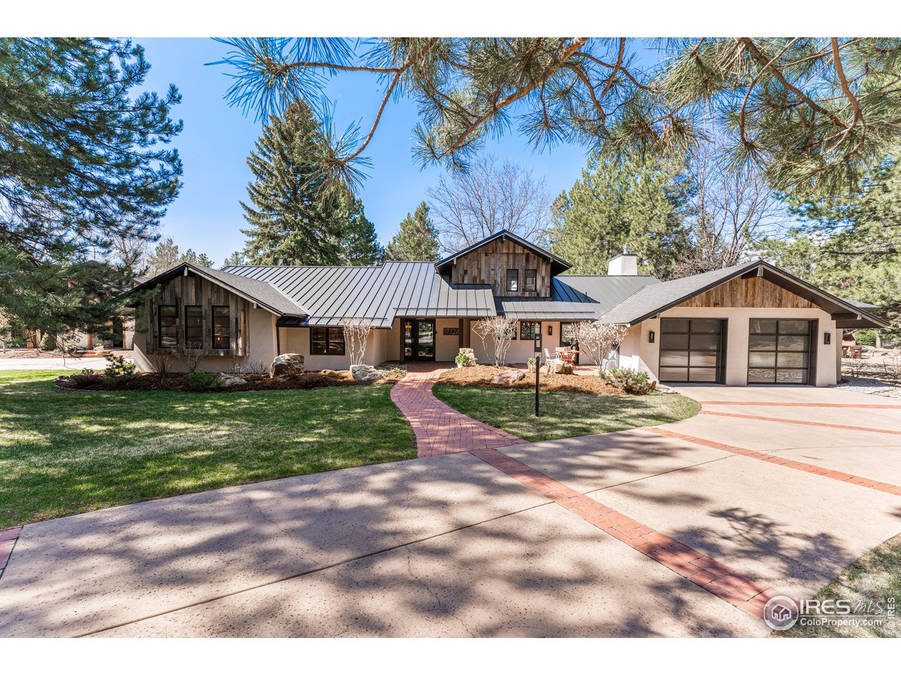 7126 Four Rivers Road Boulder, CO 80301 - Photo 1 of 38 a front view of a house with a yard