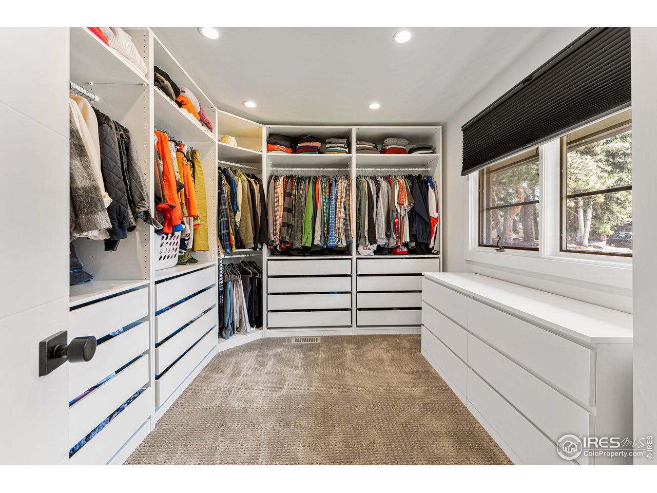 7126 Four Rivers Road Boulder, CO 80301 - Photo 12 of 38 a view of walk in closet with clothes and shoes