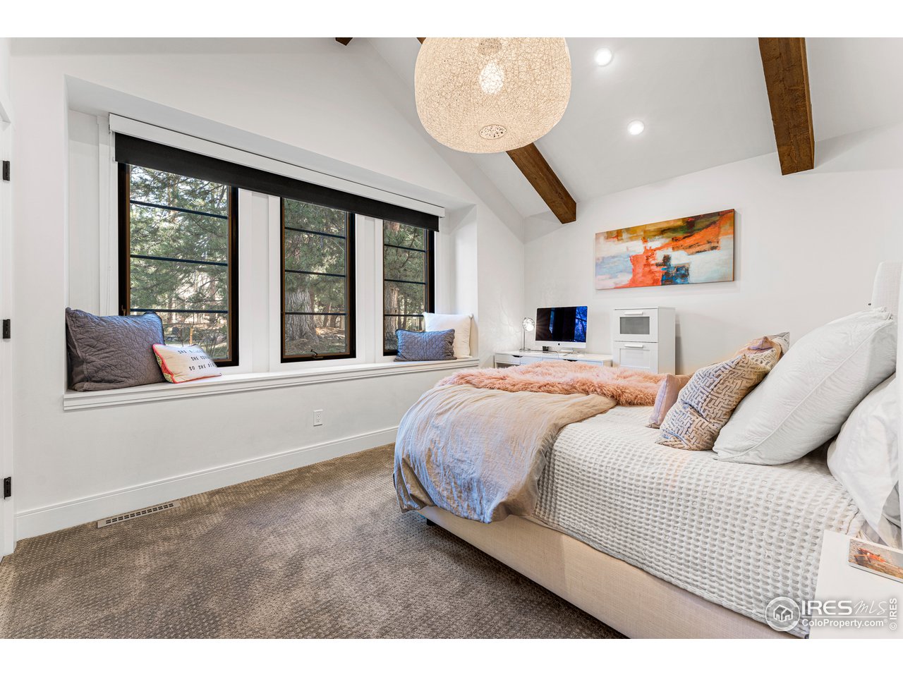 7126 Four Rivers Road Boulder, CO 80301 - Photo 15 of 38 a living room with a bed furniture and a large window