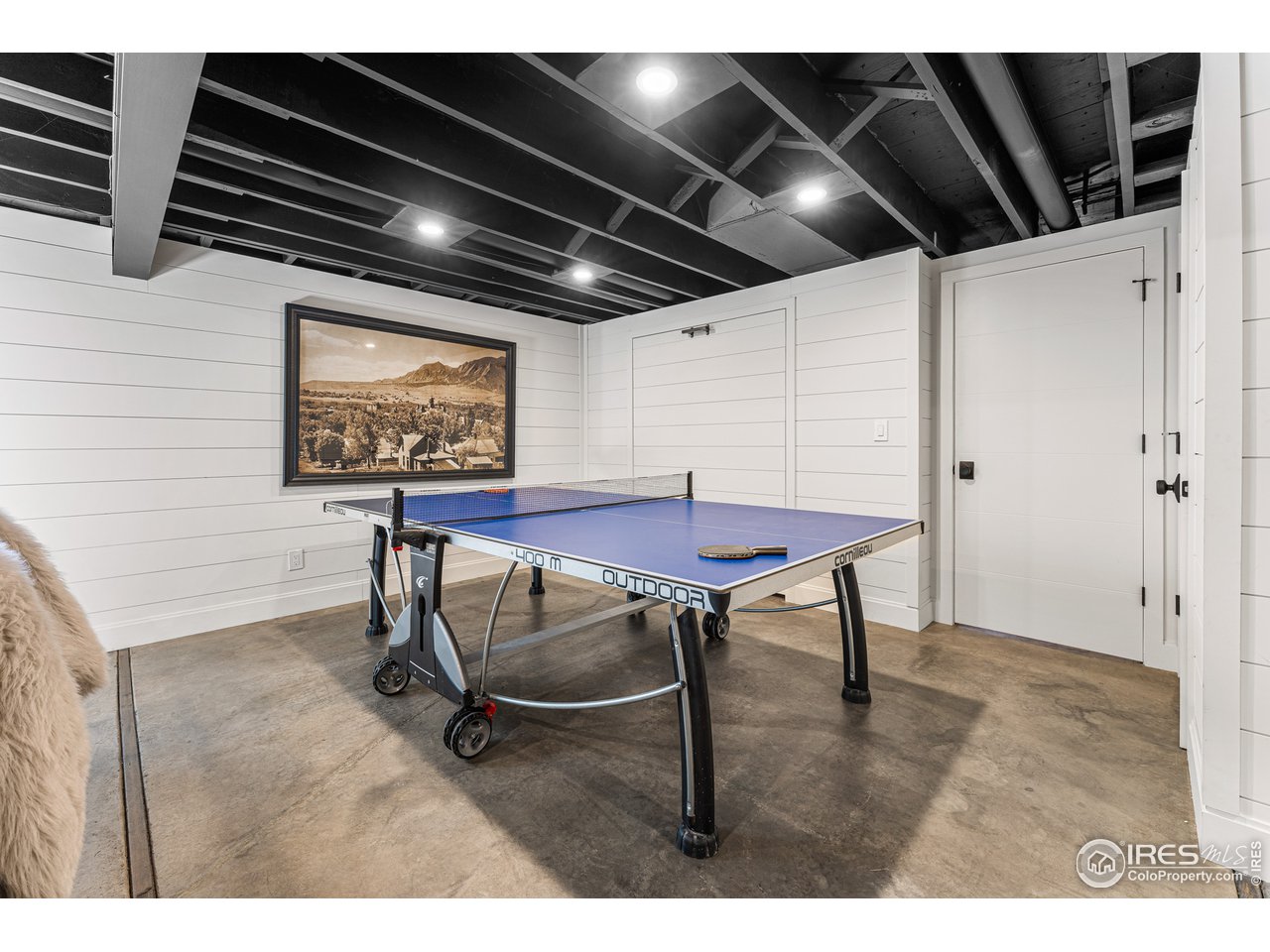7126 Four Rivers Road Boulder, CO 80301 - Photo 22 of 38 a view of an empty room with wooden floor