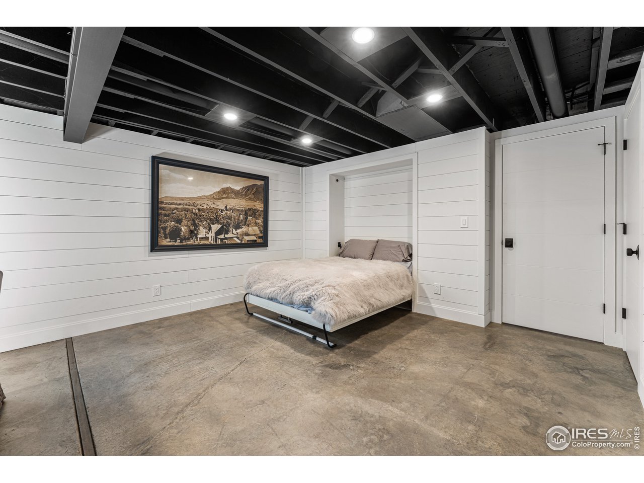 7126 Four Rivers Road Boulder, CO 80301 - Photo 23 of 38 a spacious bedroom with a bed and a walk in closet
