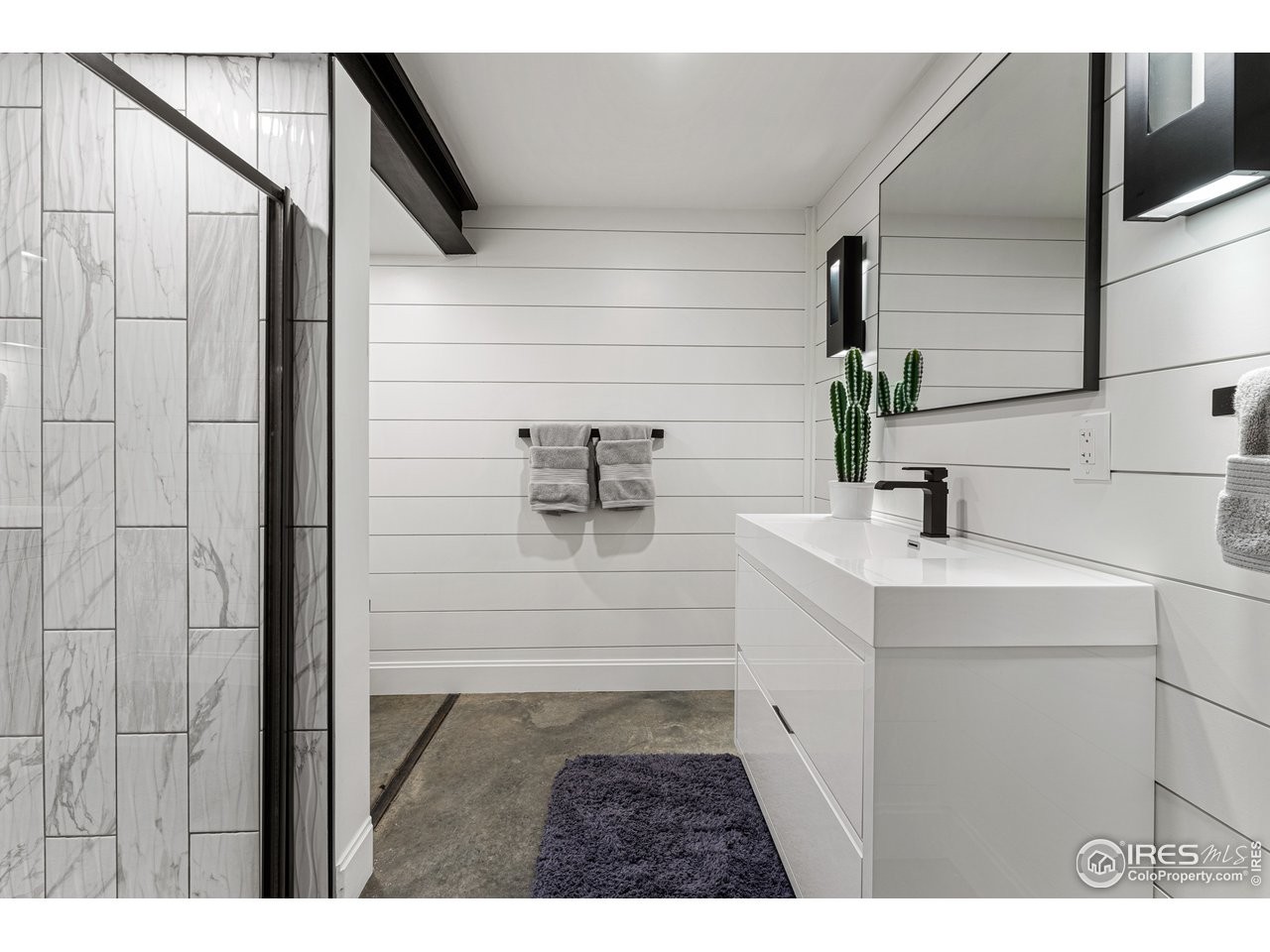 7126 Four Rivers Road Boulder, CO 80301 - Photo 24 of 38 a bathroom with a sink and mirror