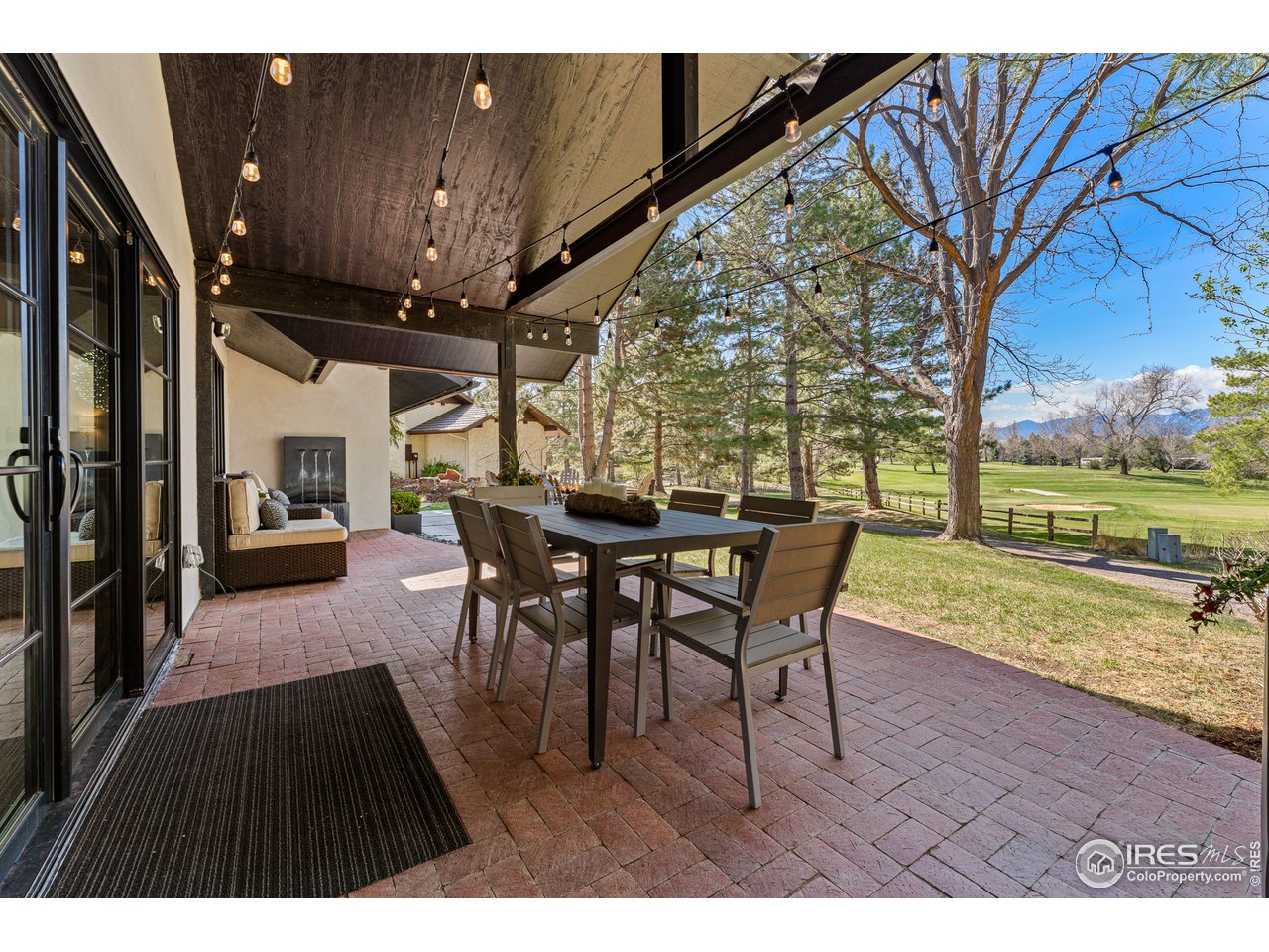 7126 Four Rivers Road Boulder, CO 80301 - Photo 26 of 38 a view of a patio with a table and chairs