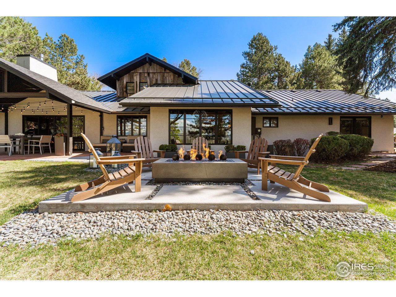 7126 Four Rivers Road Boulder, CO 80301 - Photo 27 of 38 a view of a house with backyard and sitting area