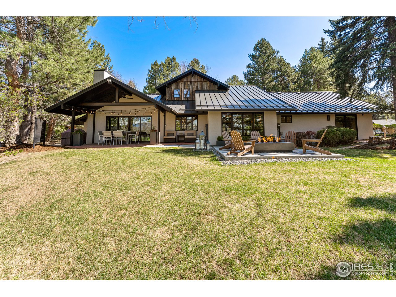 7126 Four Rivers Road Boulder, CO 80301 - Photo 29 of 38 a front view of a house with yard and trees