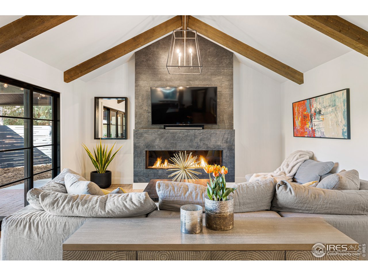 7126 Four Rivers Road Boulder, CO 80301 - Photo 7 of 38 a living room with furniture and a fireplace