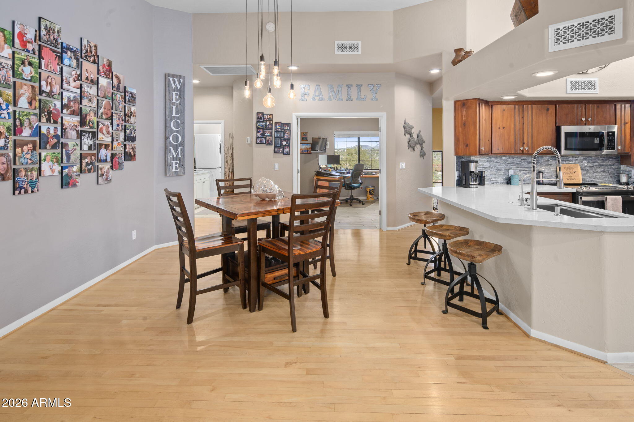 42331 North 3rd Street Phoenix, AZ 85086 - Photo 13 of 52 a view of a dining room with furniture and chandelier