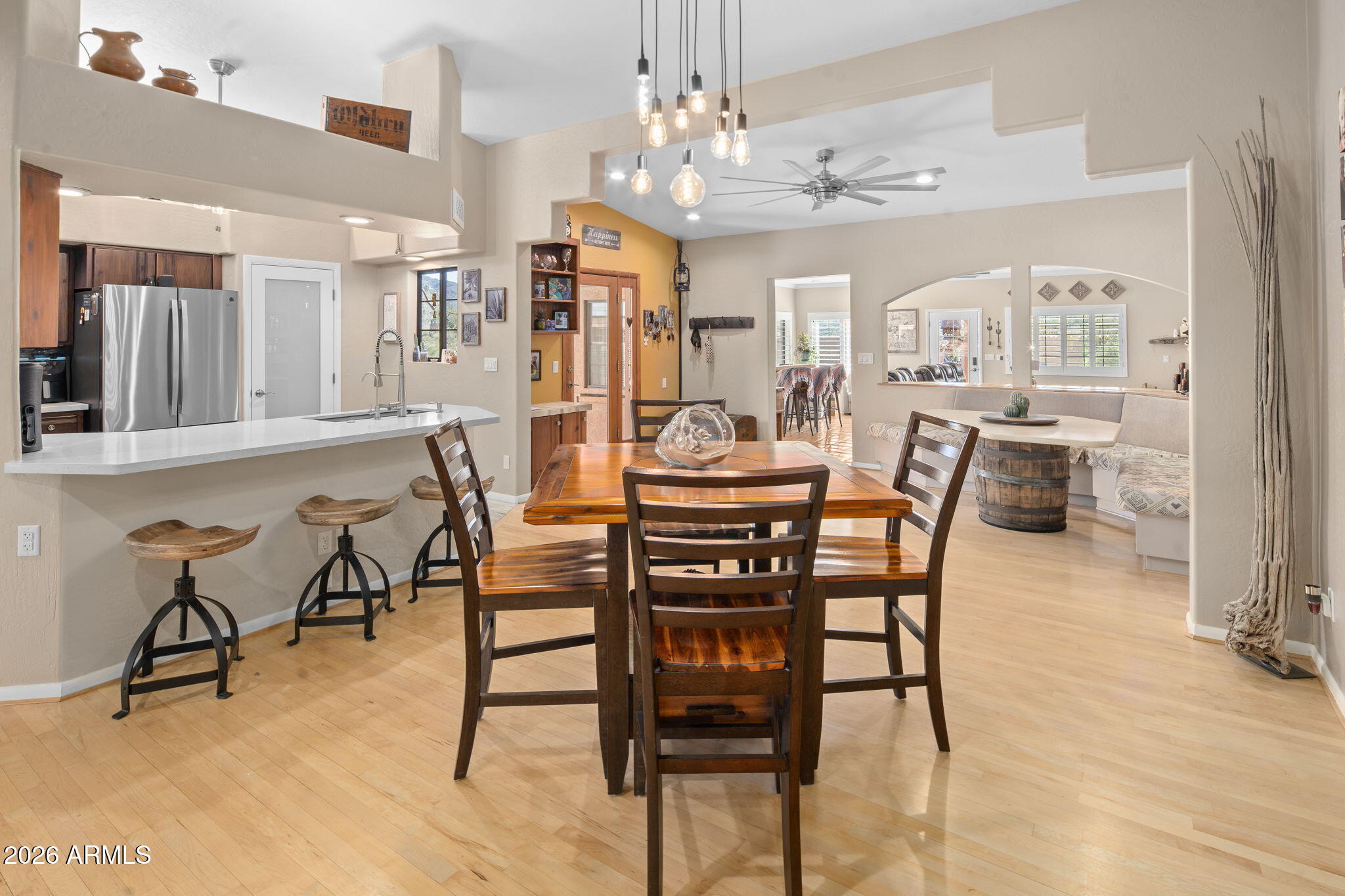 42331 North 3rd Street Phoenix, AZ 85086 - Photo 15 of 52 a view of a dining room with furniture and a chandelier
