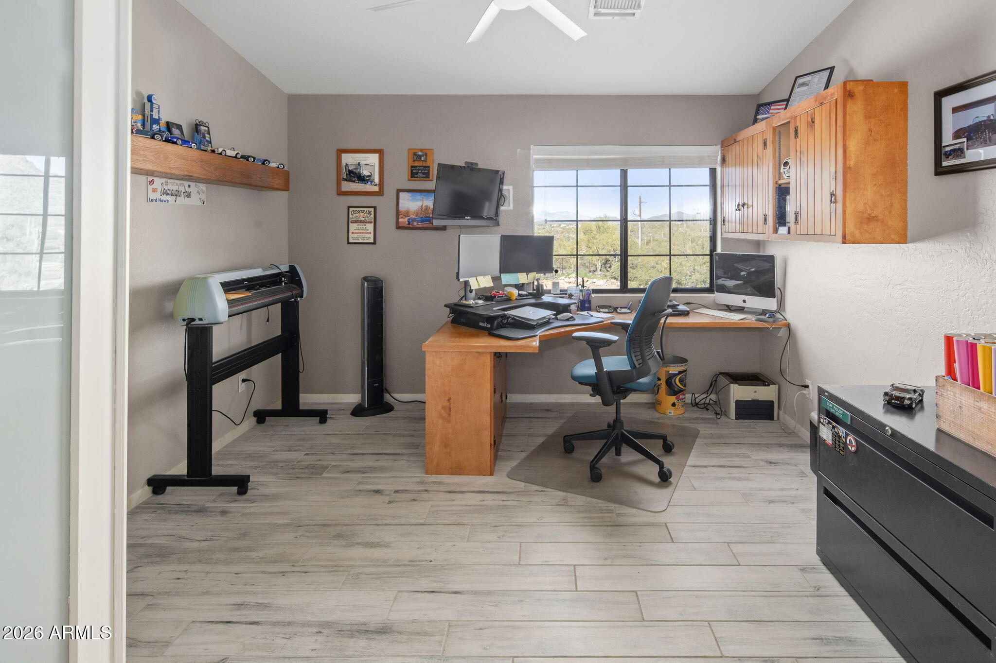 42331 North 3rd Street Phoenix, AZ 85086 - Photo 22 of 52 a view of a workspace with furniture and a window