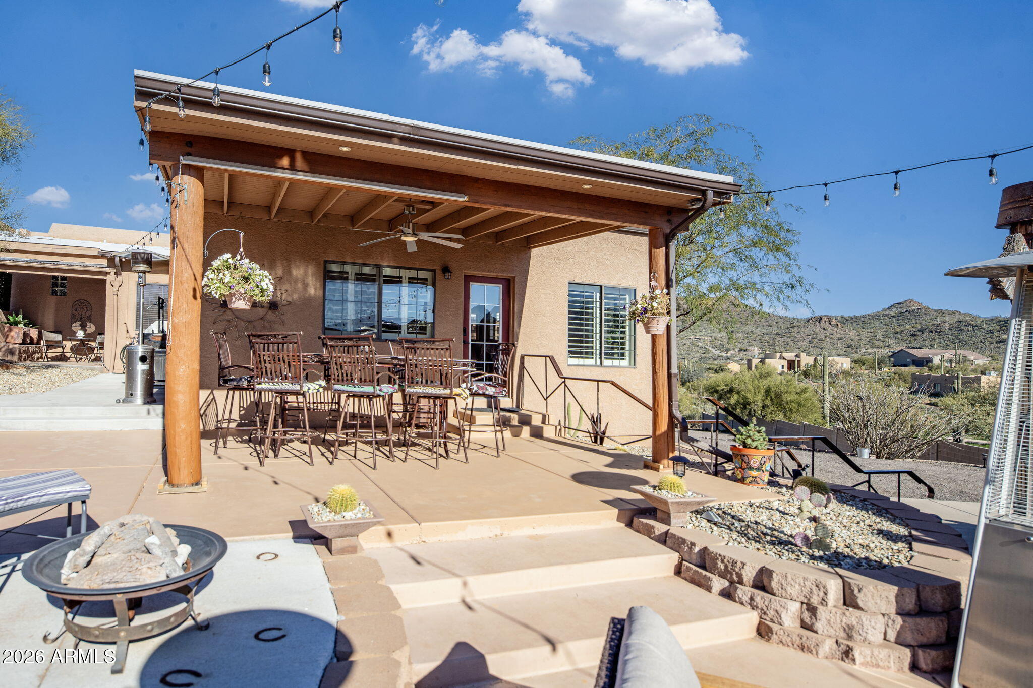 42331 North 3rd Street Phoenix, AZ 85086 - Photo 33 of 52 a view of a patio with table and chairs potted plants with sky view