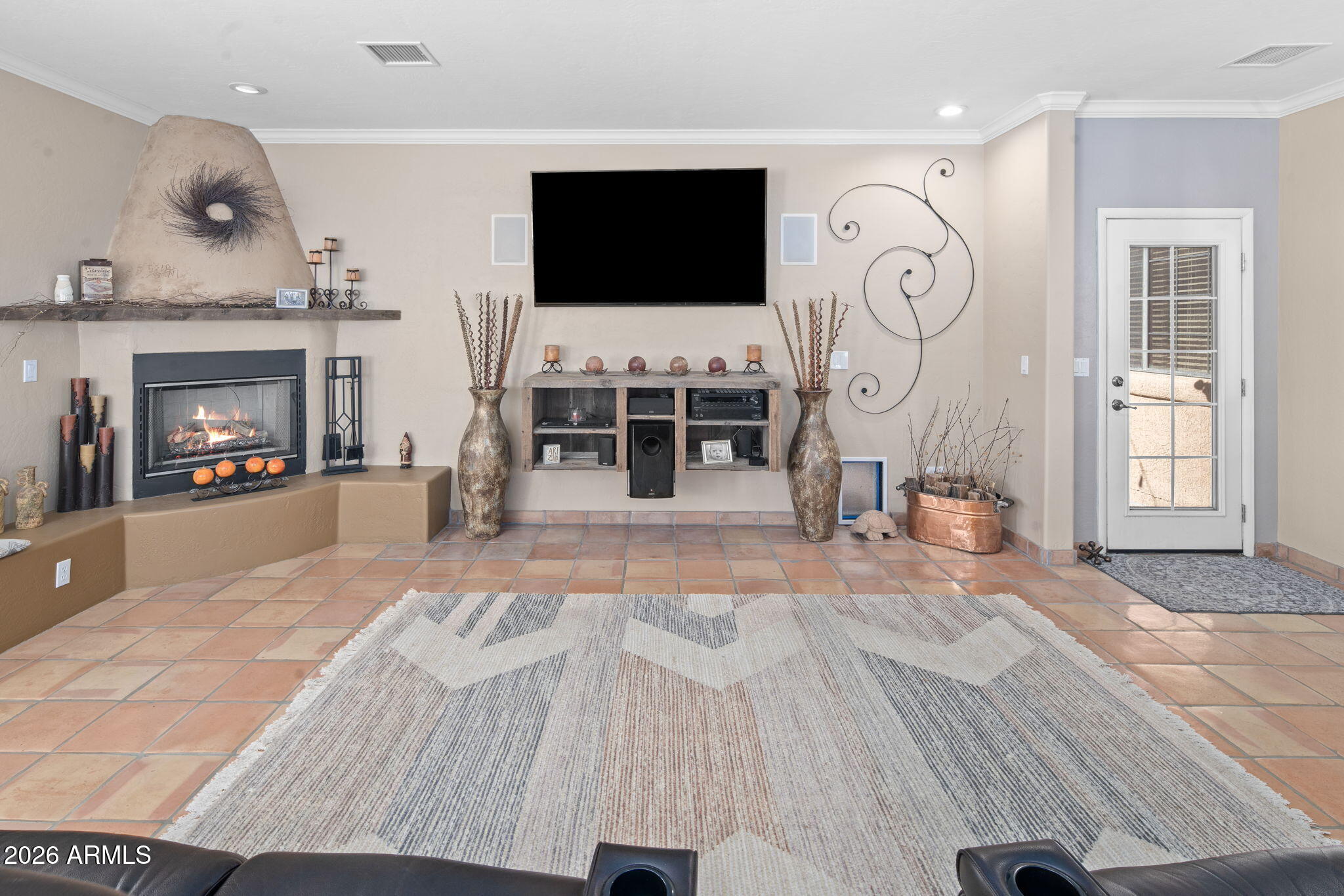 42331 North 3rd Street Phoenix, AZ 85086 - Photo 7 of 52 a living room with furniture a flat screen tv and a fireplace