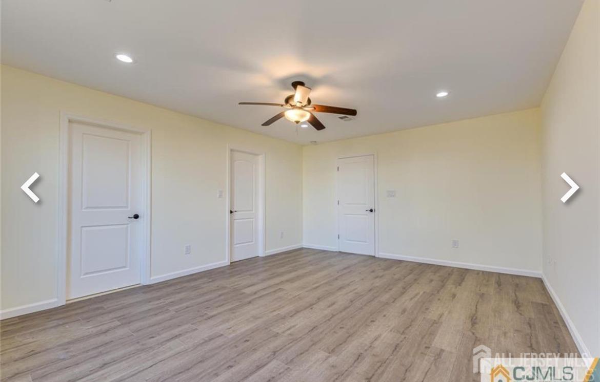 19 Henry Street Edison, NJ 08820 - Photo 17 of 33 wooden floor in an empty room with a window