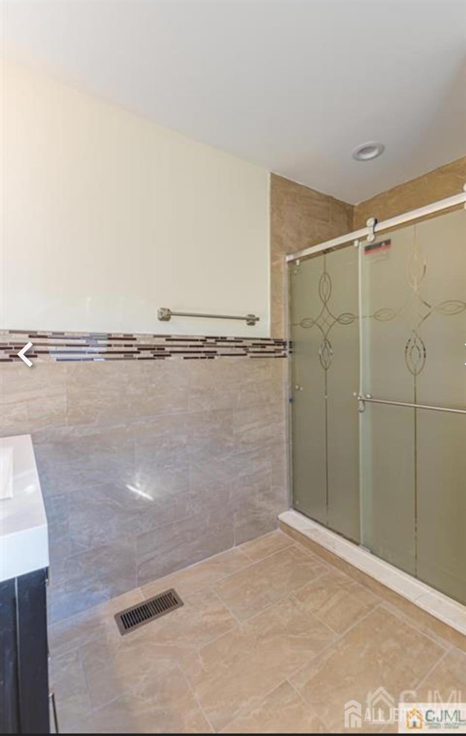 19 Henry Street Edison, NJ 08820 - Photo 19 of 33 a bathroom with a shower