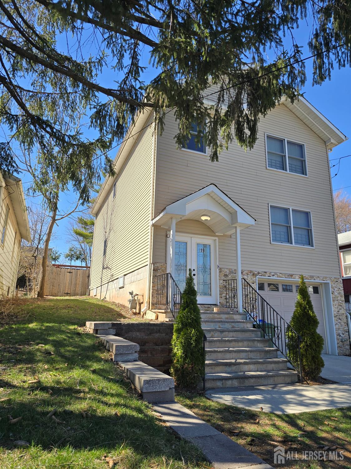 19 Henry Street Edison, NJ 08820 - Photo 2 of 33 a front view of a house with a yard