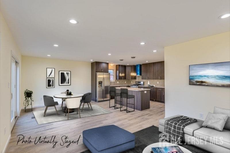 19 Henry Street Edison, NJ 08820 - Photo 6 of 33 a living room with furniture and view of kitchen
