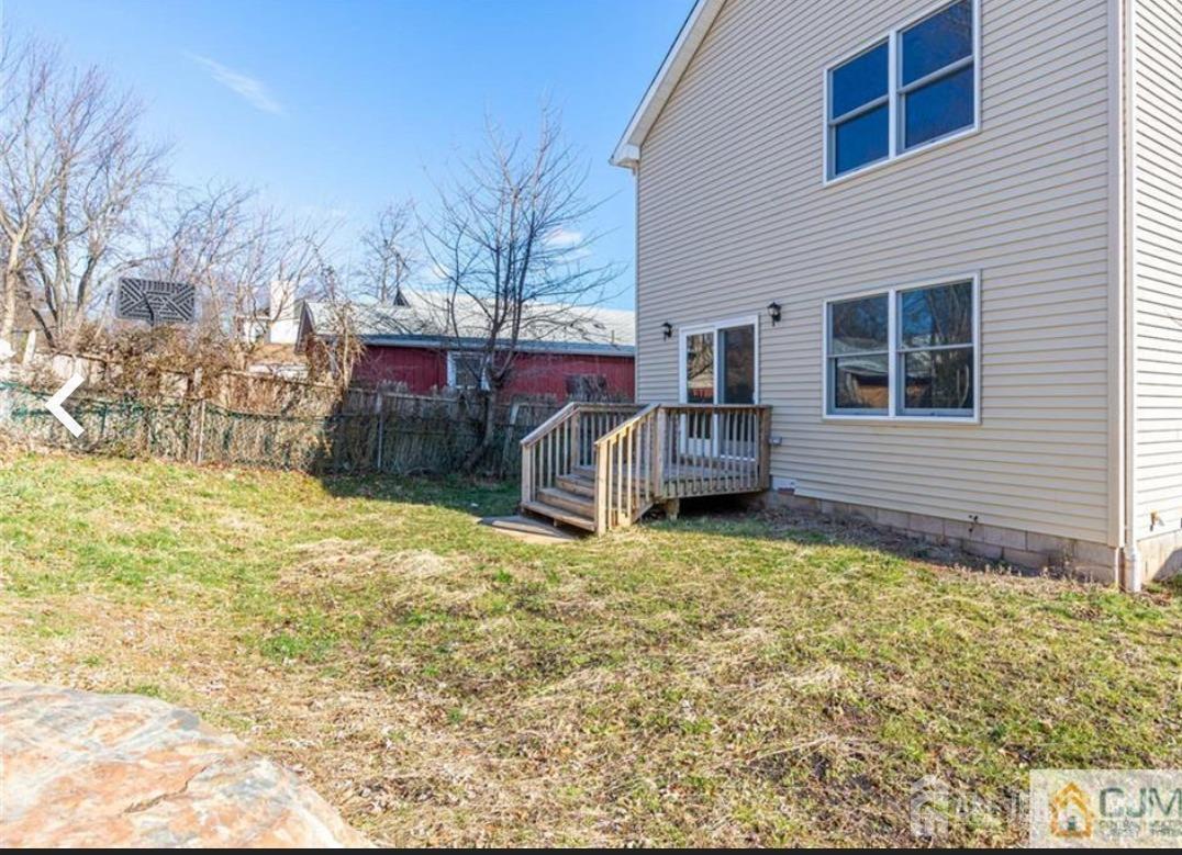 19 Henry Street Edison, NJ 08820 - Photo 8 of 33 a view of a house with a yard