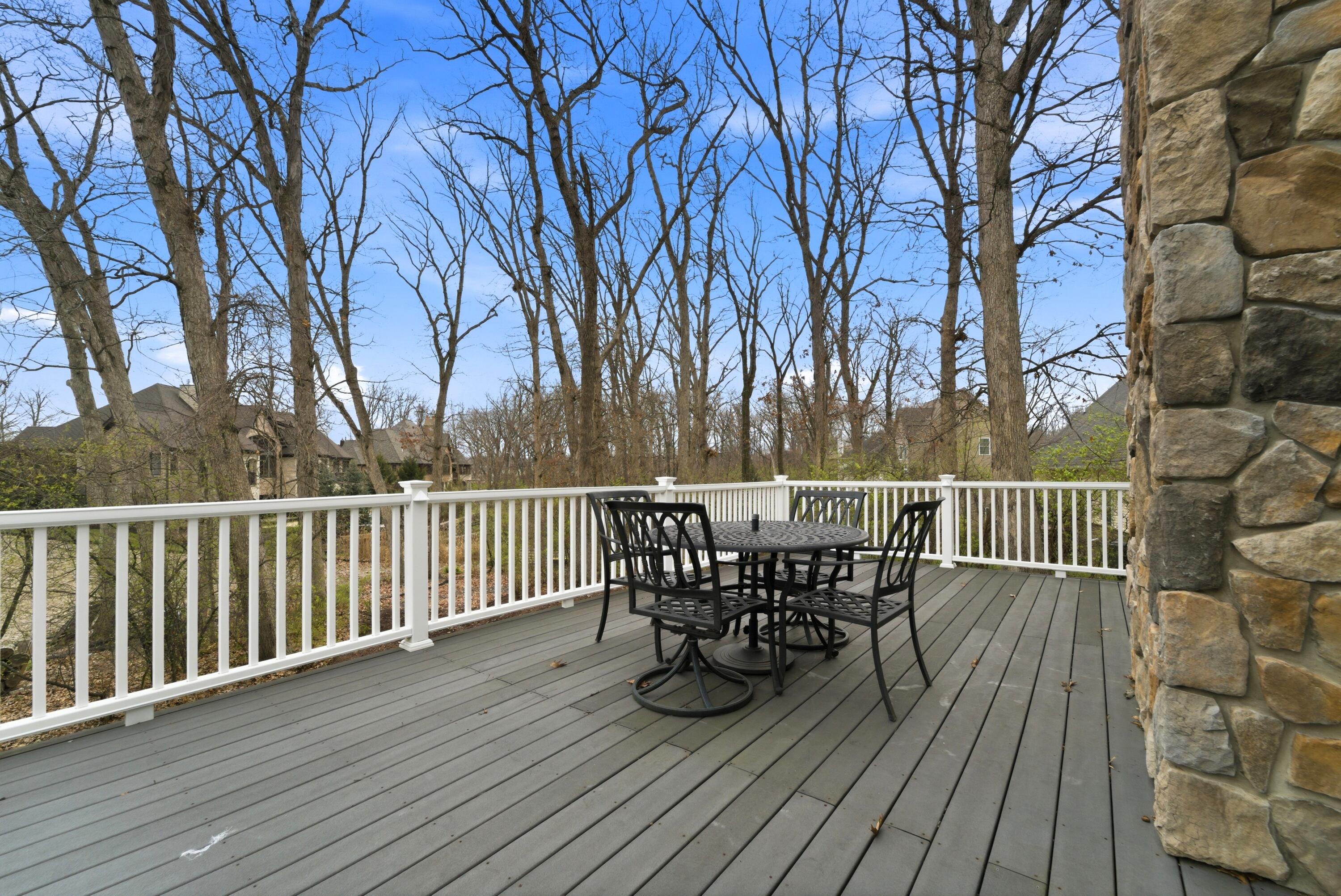 730 Quinlan Court Crown Point, IN 46307 - Photo 64 of 74 a view of a deck with table and chairs and wooden floor