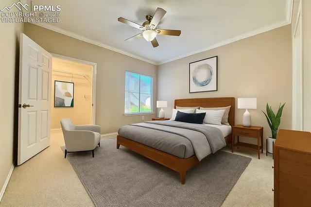 a bedroom with a bed couch and window