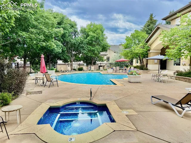 a view of a swimming pool with a patio