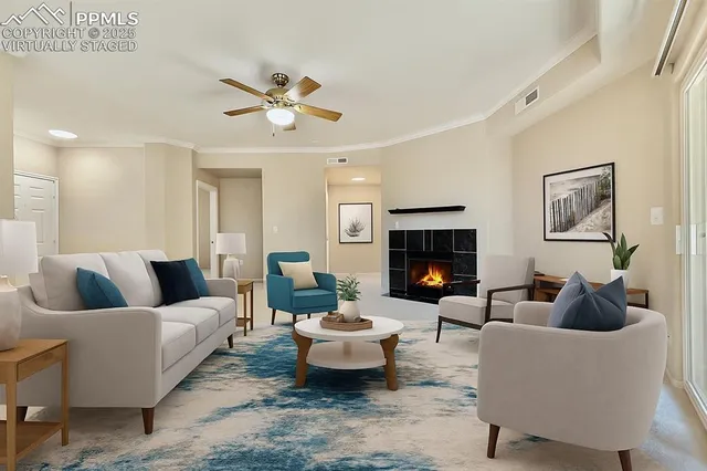 a living room with furniture and a fireplace