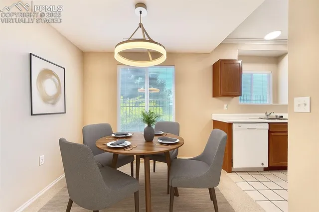 a view of a dining room with furniture and window