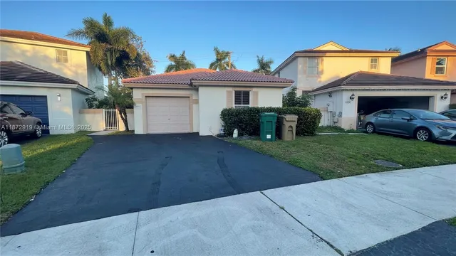 a view of an empty room and a window