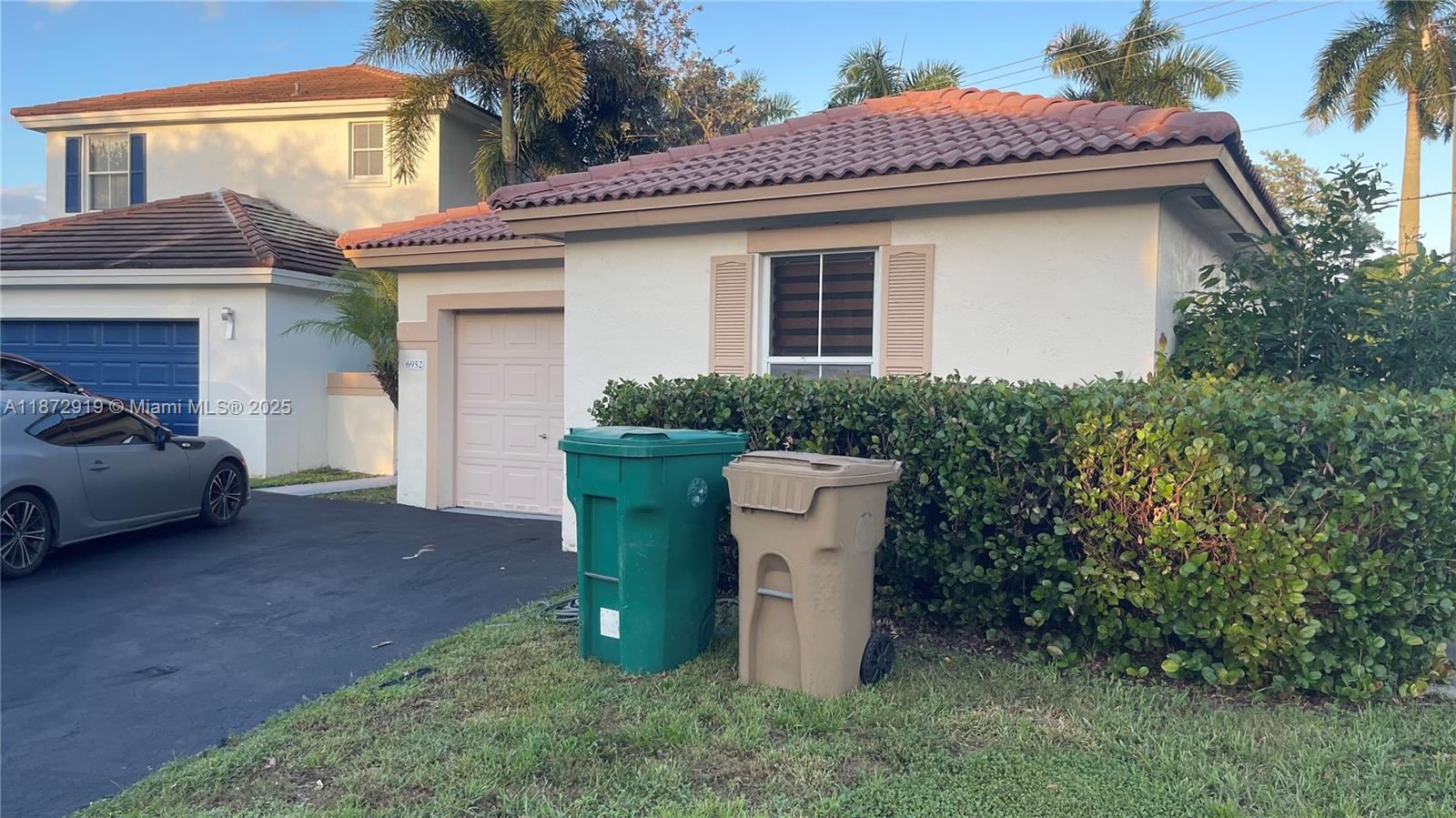 6952 Southwest 148 Lane Davie, FL 33331 - Photo 19 of 100 a view of a house with a sink and yard