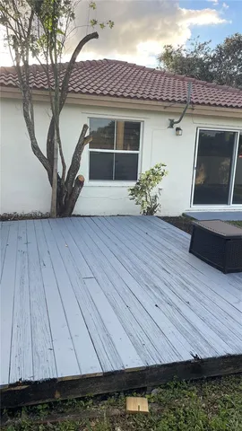 a kitchen with granite countertop cabinets stainless steel appliances a sink and a window