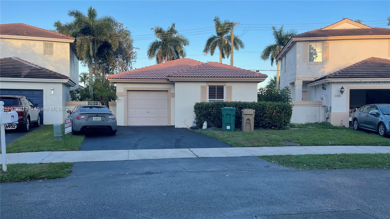 6952 Southwest 148 Lane Davie, FL 33331 - Photo 32 of 100 a house view with a garden space