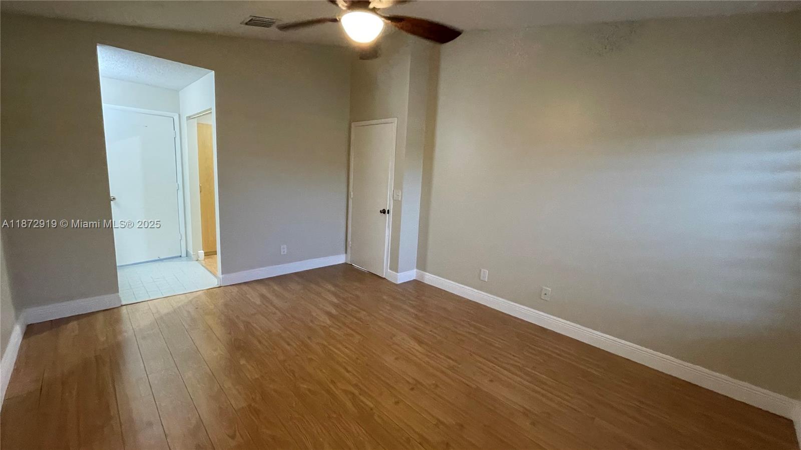 6952 Southwest 148 Lane Davie, FL 33331 - Photo 50 of 100 an empty room with wooden floor