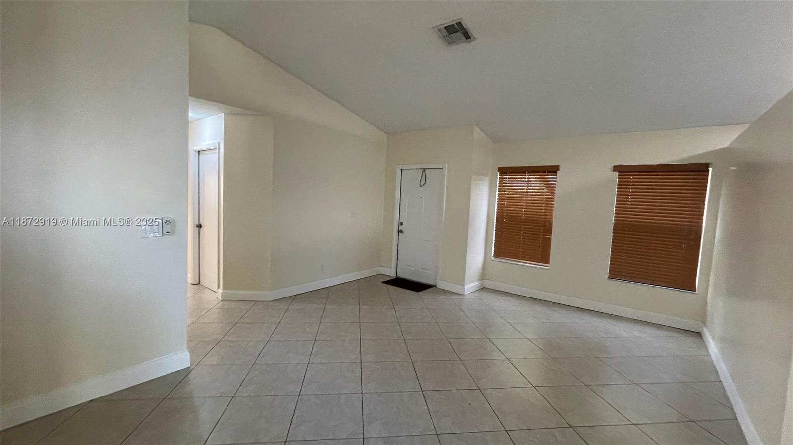 6952 Southwest 148 Lane Davie, FL 33331 - Photo 73 of 100 an empty room with entrance and mirror