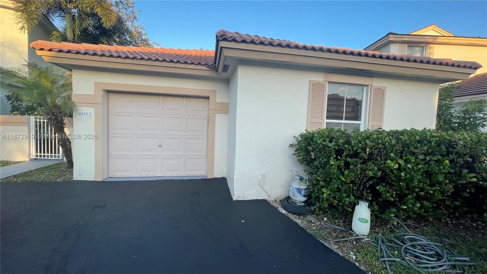 6952 Southwest 148 Lane Davie, FL 33331 - Photo 8 of 100 a view of a house with potted plants