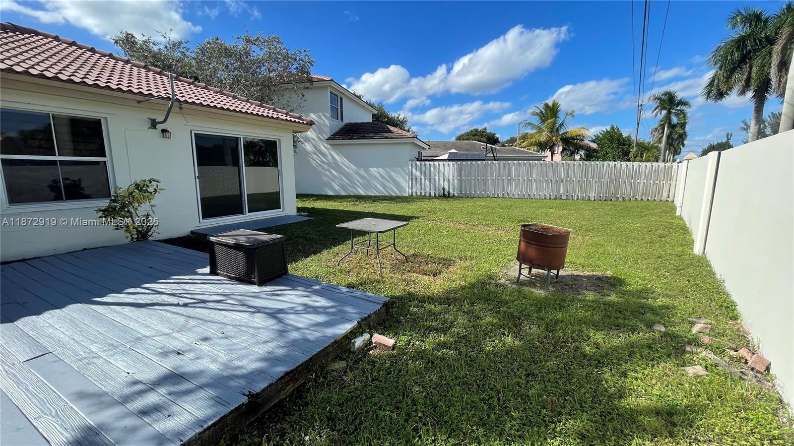 6952 Southwest 148 Lane Davie, FL 33331 - Photo 92 of 100 a view of an house with backyard and sitting area