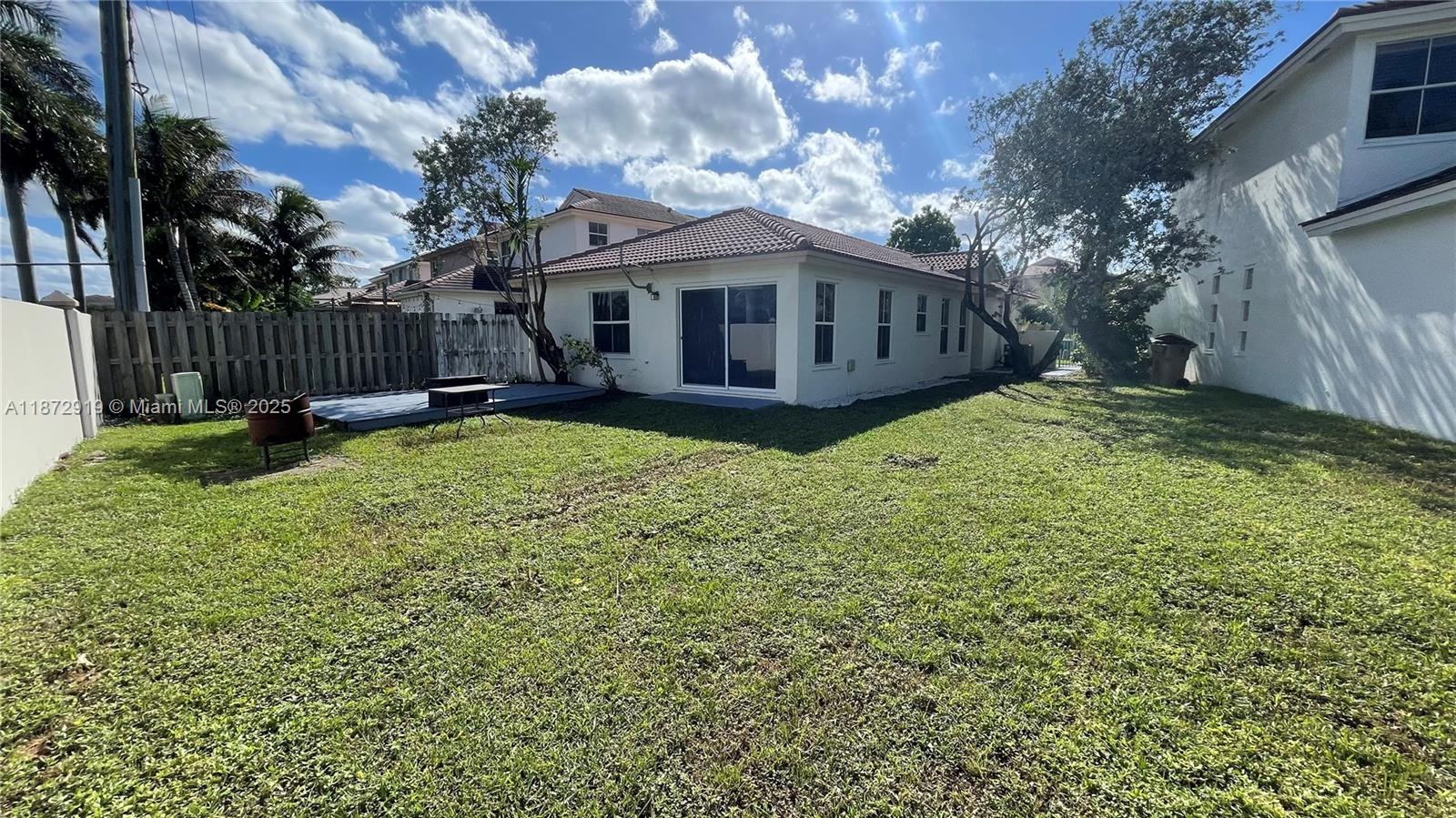 6952 Southwest 148 Lane Davie, FL 33331 - Photo 95 of 100 a view of a house with backyard and sitting area