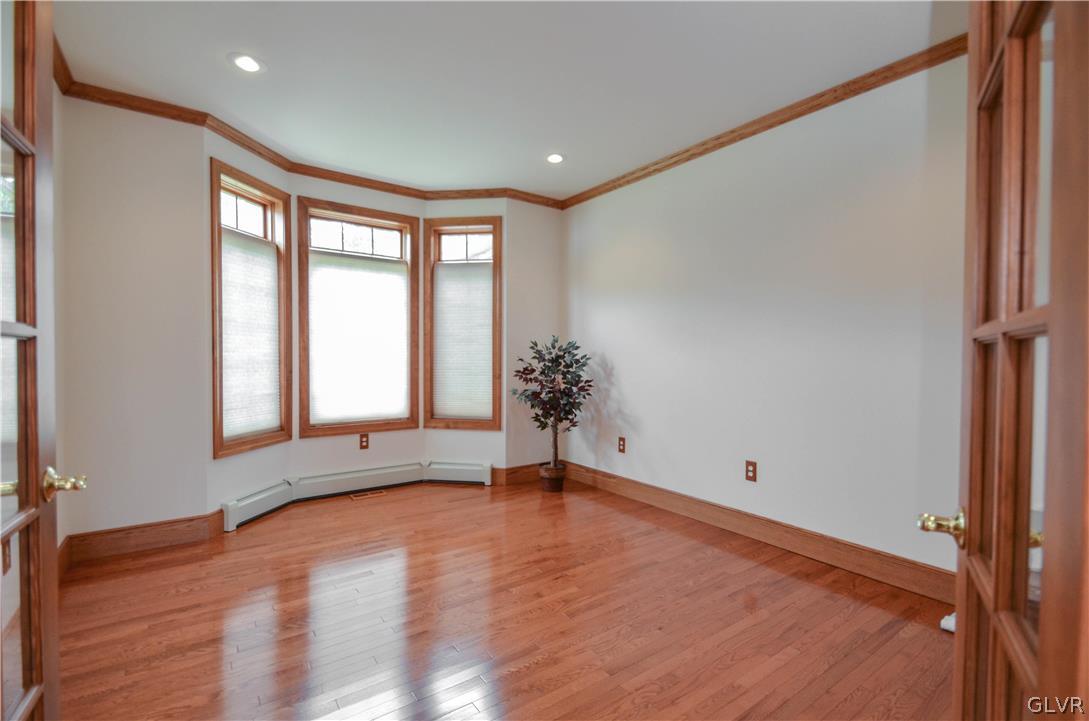 2359 Wehr Mill Road Allentown, PA 18104 - Photo 18 of 50 a view of an empty room with wooden floor and a window