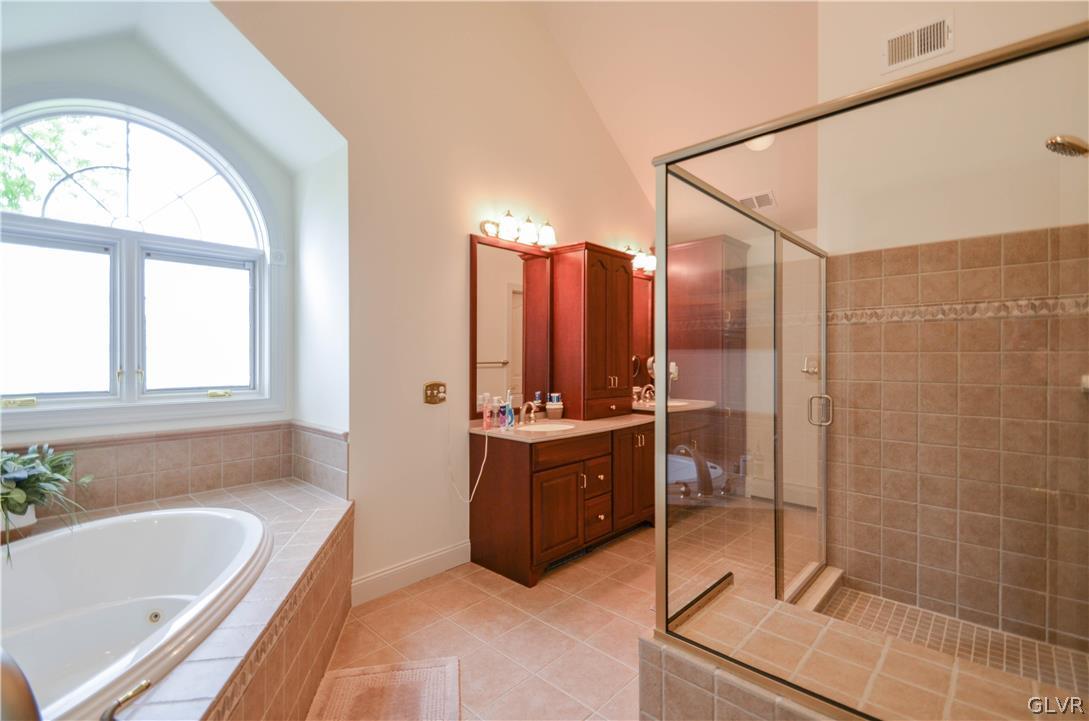 2359 Wehr Mill Road Allentown, PA 18104 - Photo 21 of 50 a bathroom with a tub a sink and mirror