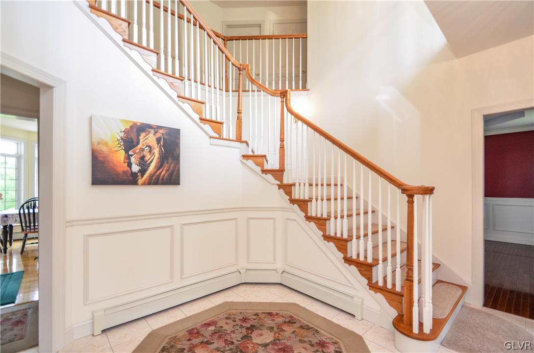 2359 Wehr Mill Road Allentown, PA 18104 - Photo 6 of 50 a view of staircase with wooden floor and a rug