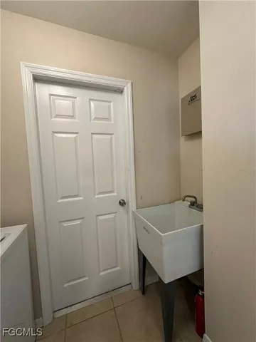 a bathroom with a tub sink and vanity