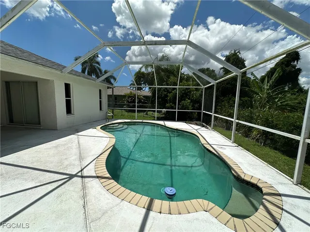 a view of a house with a backyard and porch