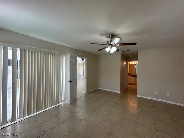 a view of a livingroom with a chandelier fan