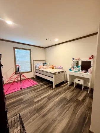 a bedroom with a bed and a table