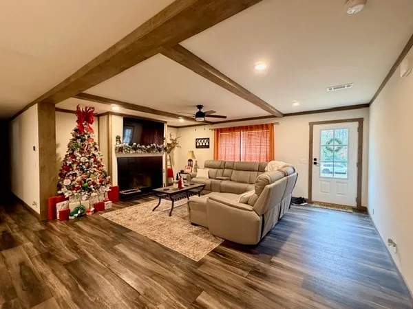 a living room with furniture and a fireplace