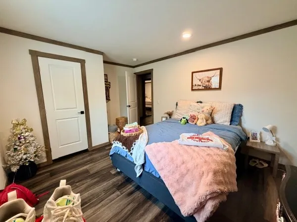 a bedroom with bed and a window