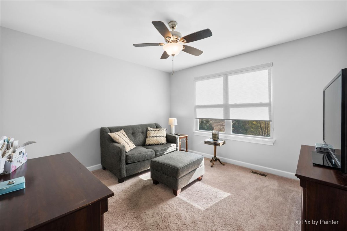 4375 Rudyard Kipling Road Elgin, IL 60124 - Photo 24 of 33 a living room with furniture and a window